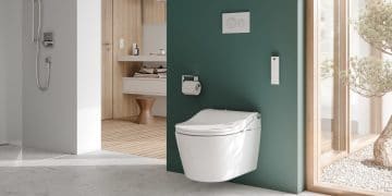 WC lavant blanc sur mur vert