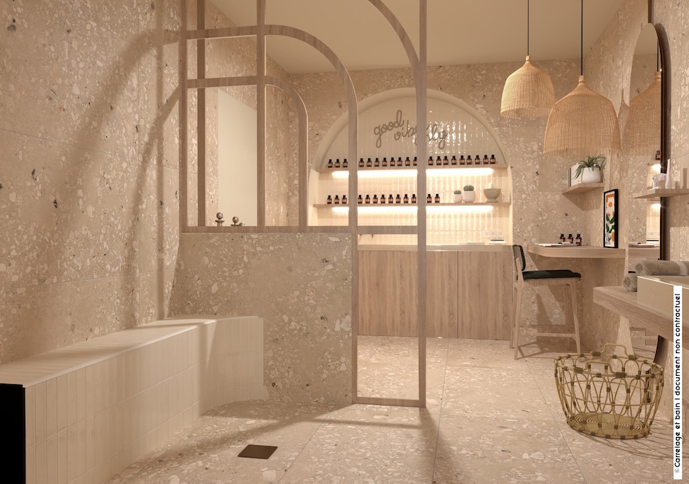 Vue d'une salle de bains atelier de cosmétiques, ambiance naturelle grâce au carelage travertin